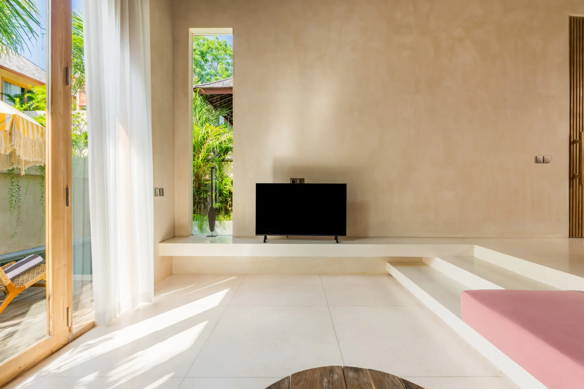 Contemporary living space with natural light and access to outdoors