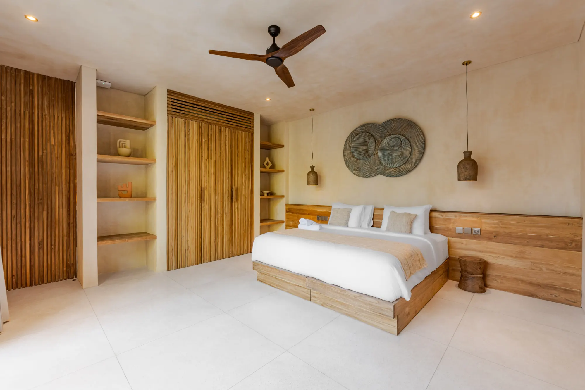 Bedroom featuring wooden headboard and garden patio access