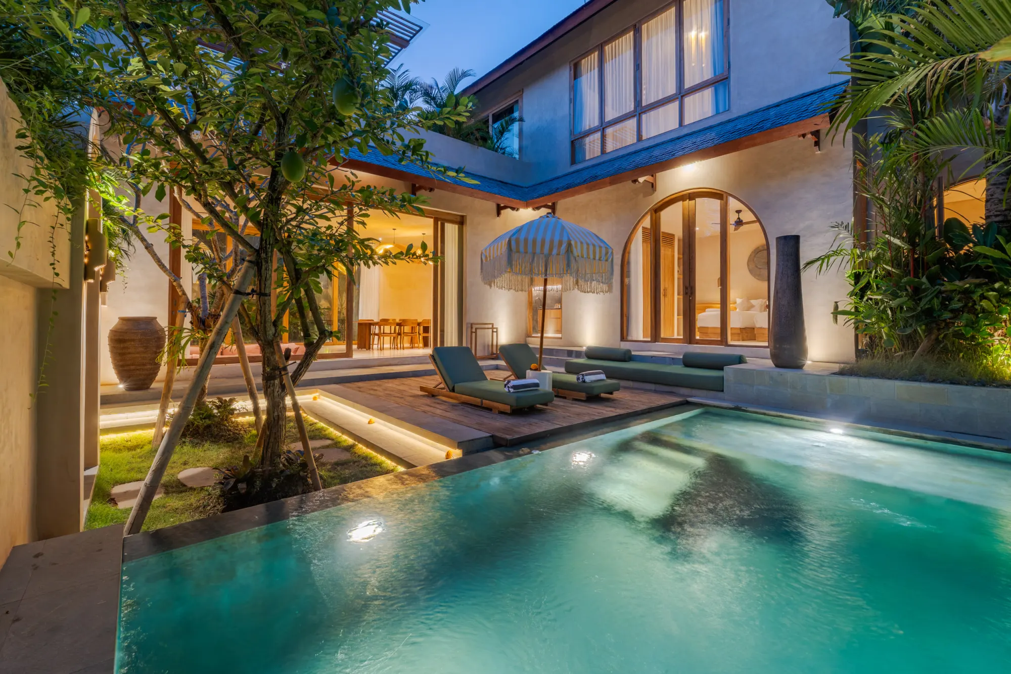 Interior space with floor-to-ceiling doors opening to pool