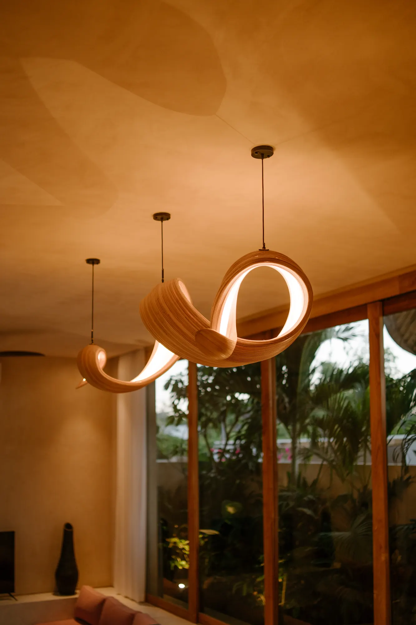 Modern wooden curved pendant lights in interior