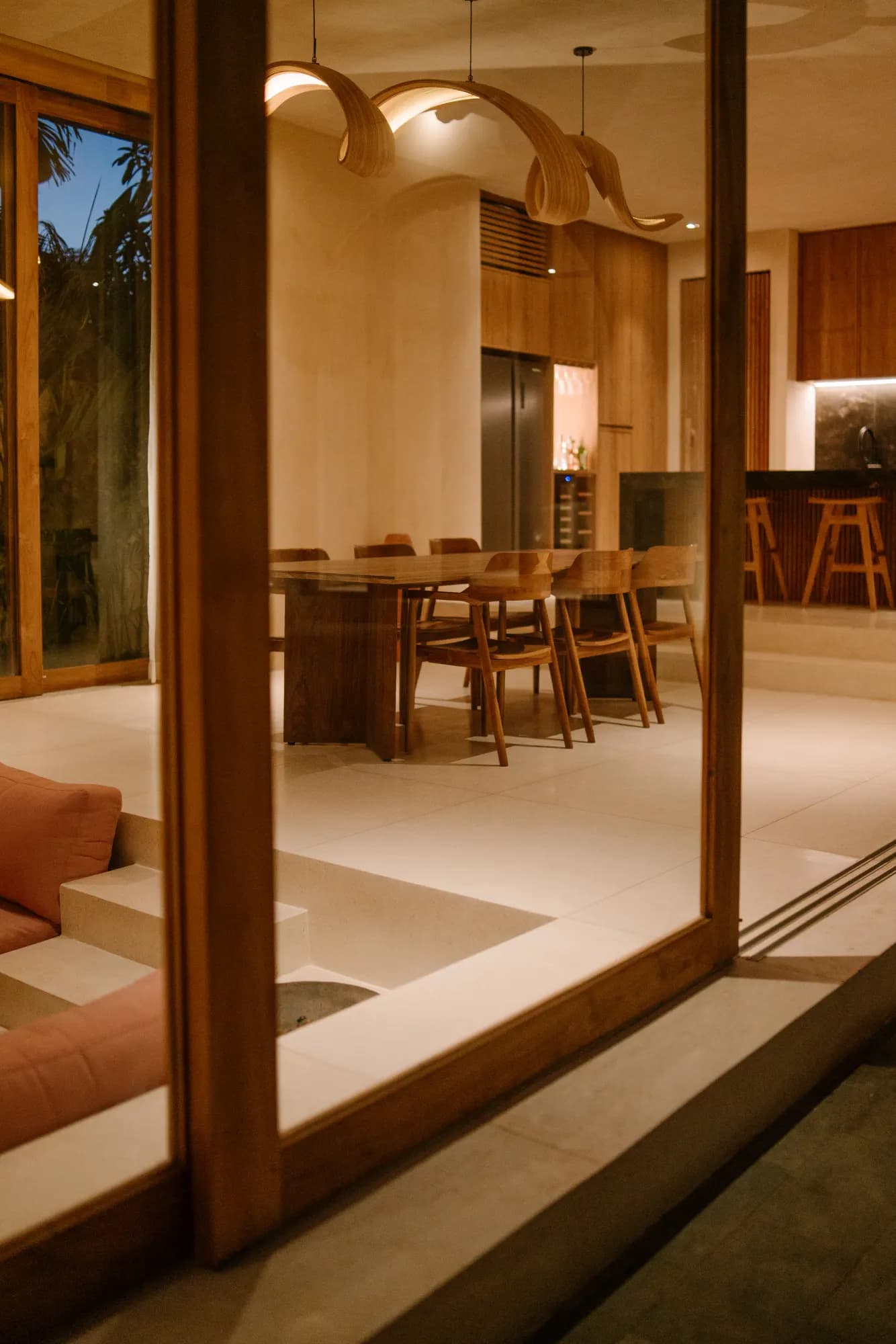 Formal dining room with sculptural pendant lights