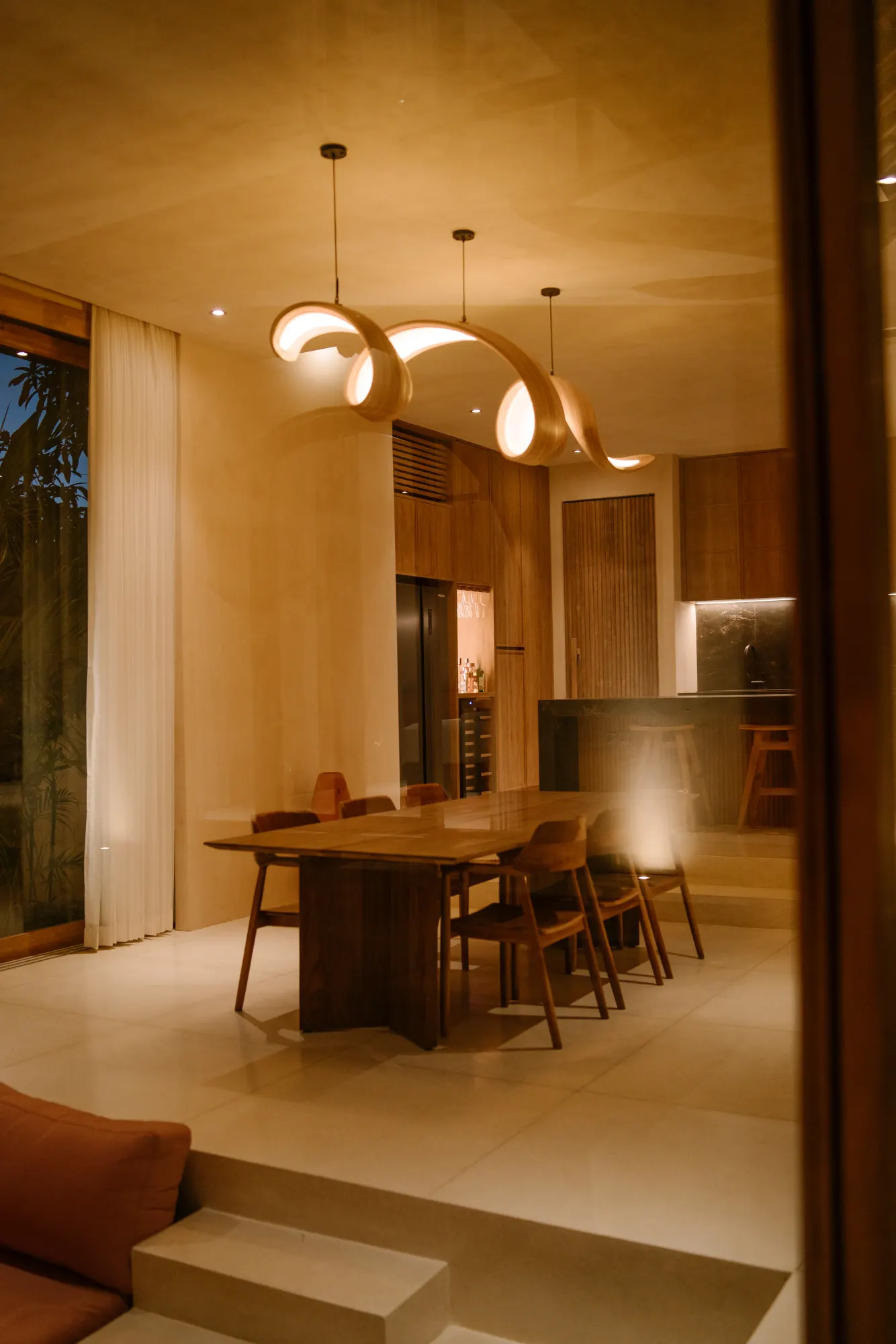 Dining area viewed from living room through passage