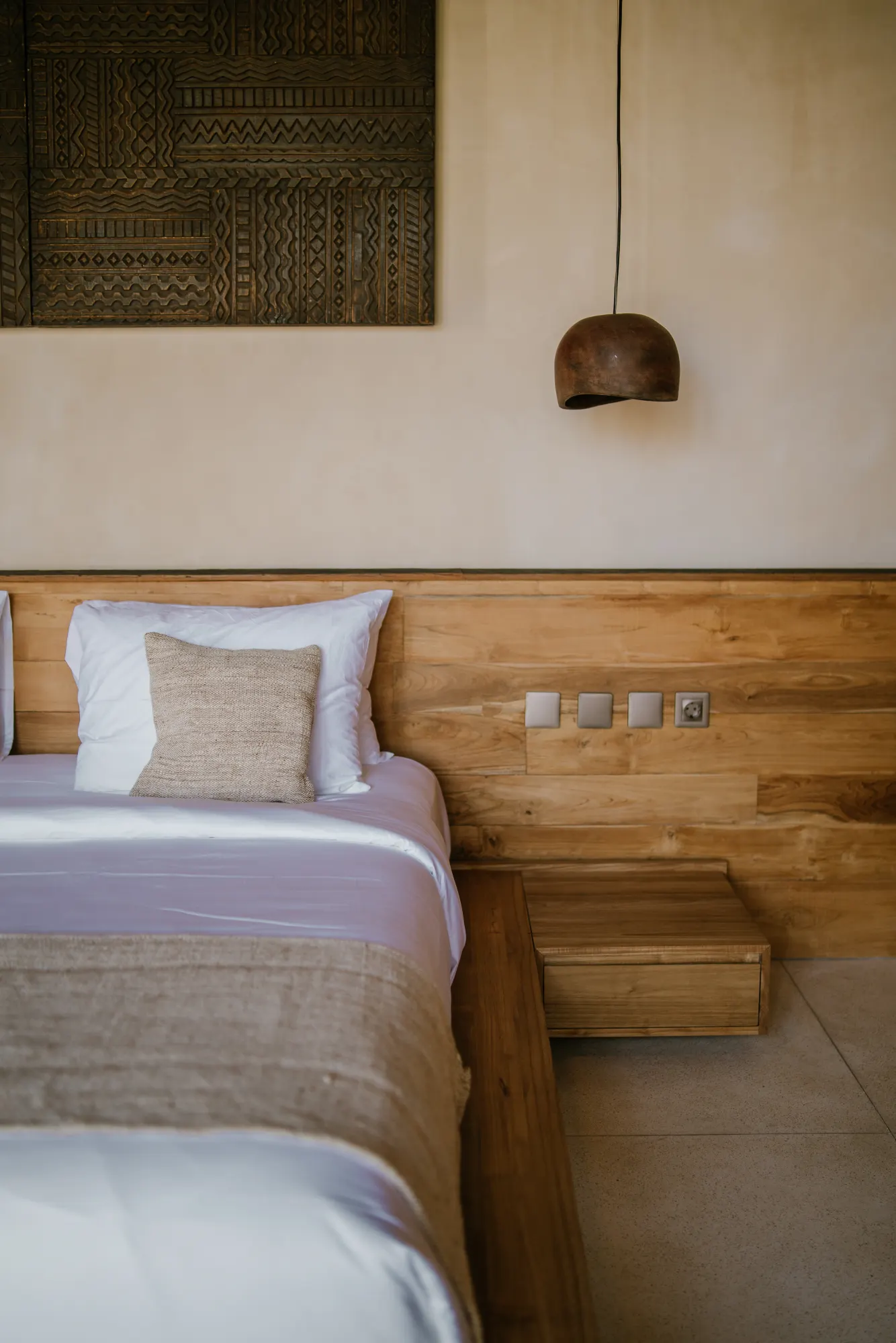 Contemporary bedroom with wood frame and wall art