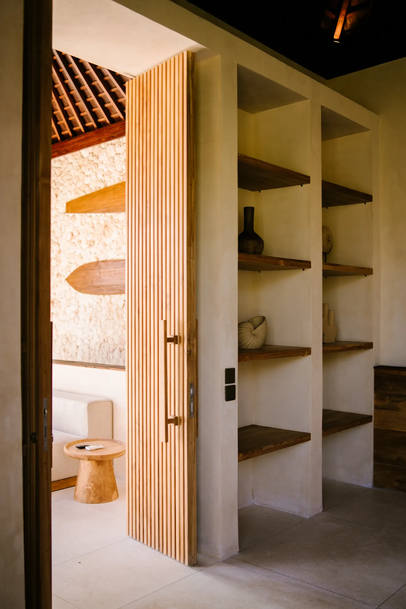Interior passage with open doors and artistic elements