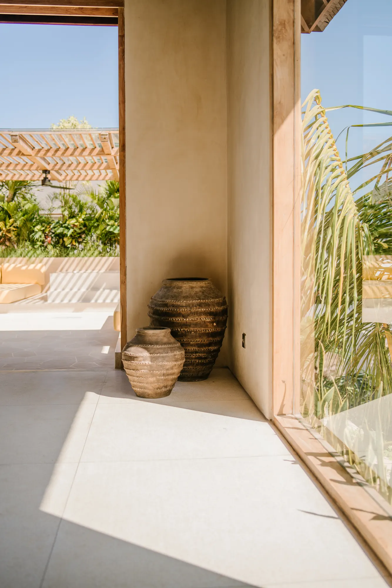 Indoor doorway with decorative baskets and plantings