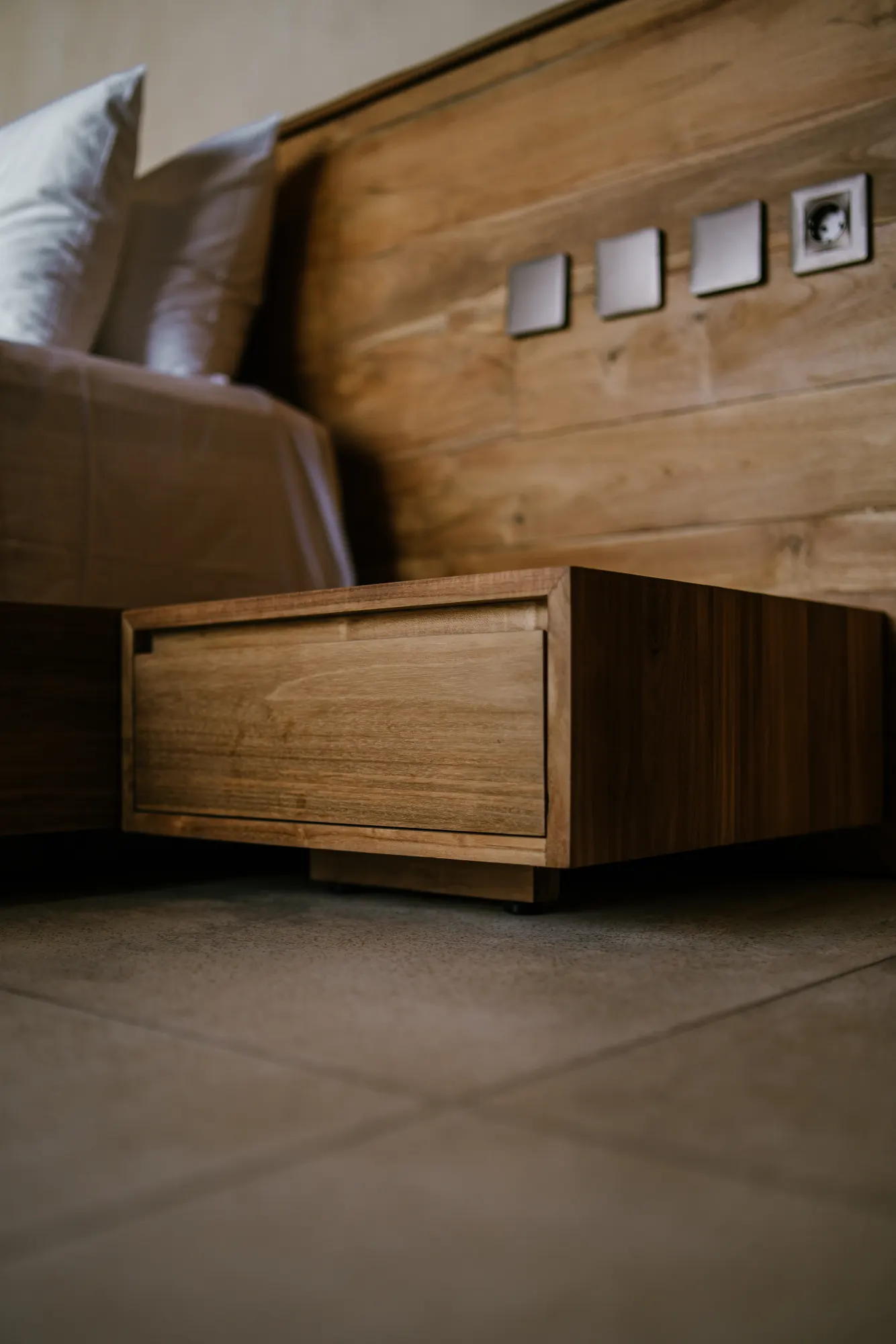 Decorative carved wooden trim on bed frame