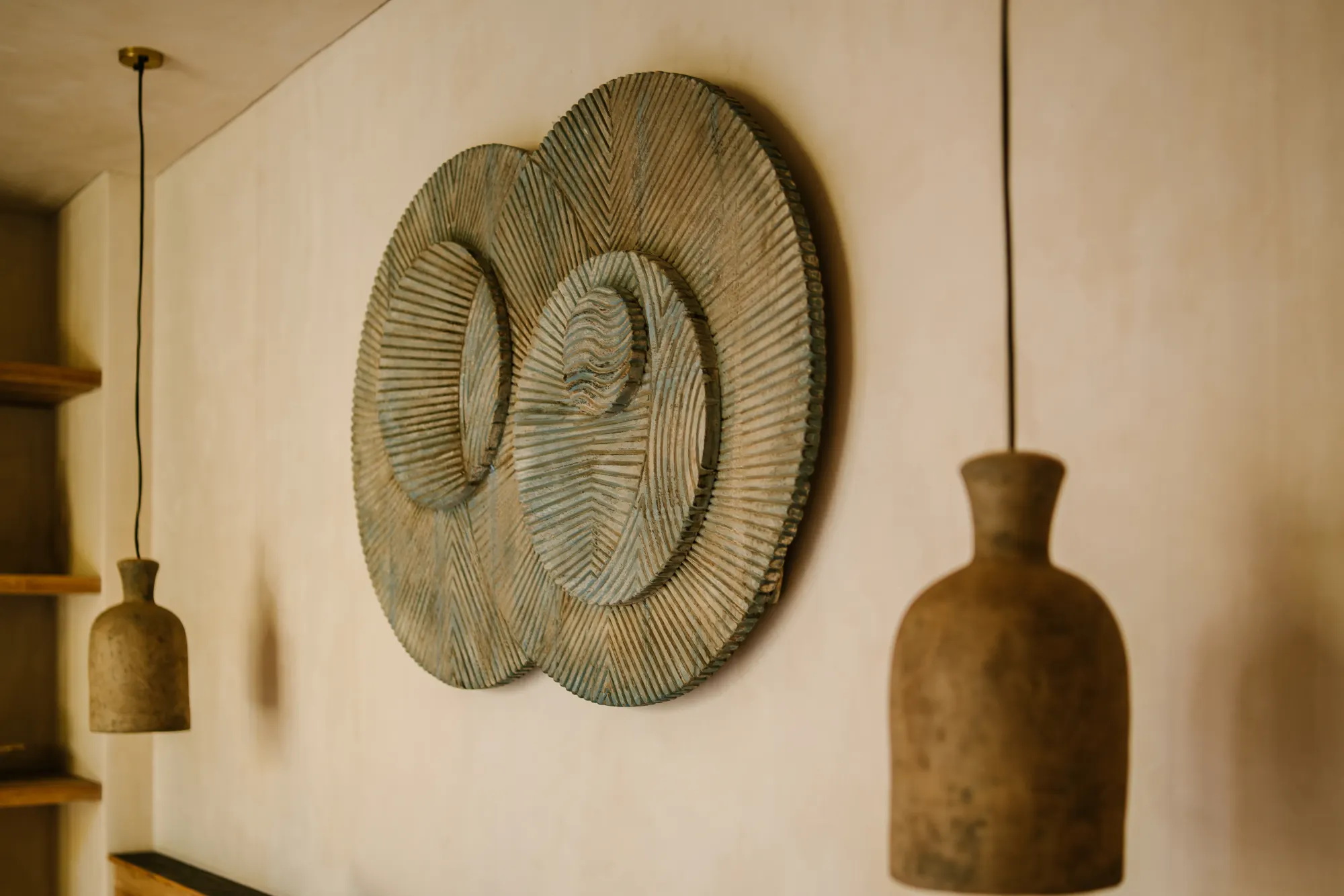 Pendant light and decorative wall art in modern space