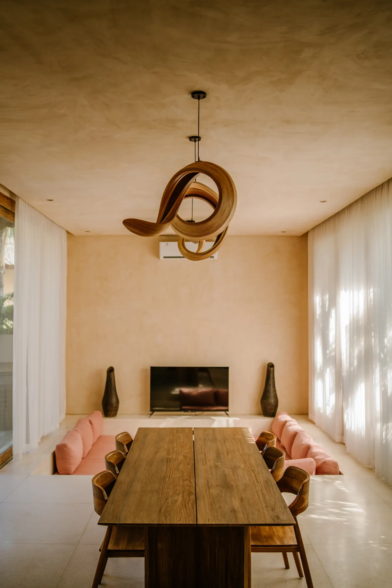 Open-plan living room with sofa and wooden accents